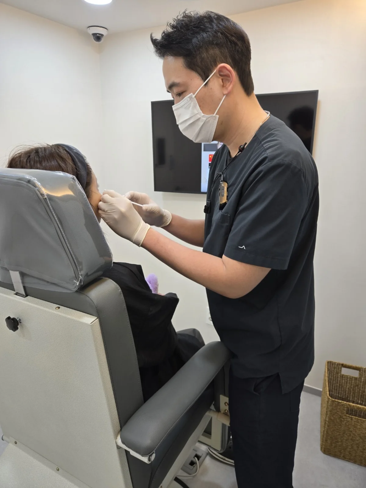 Doctor performing precise lip filler injection